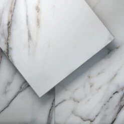 Lucida Surfaces TerraCore Calacatta 12 In. W X 24 In. L Click-Lock Luxury Vinyl Tile (16 Sq.ft. / Case) 12 Lucida Surfaces TerraCore Calacatta 12 In. W X 24 In. L Click-Lock Luxury Vinyl Tile (16 Sq.ft. / Case) -Flooring Store c2c63e61c2e5aa45b0f73bbb0db8bed7 1800x1800